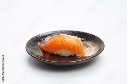 Close up of salmon nigiri isolated on white background. 