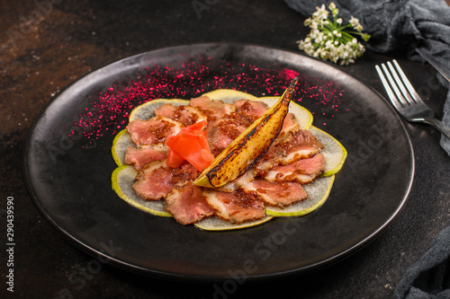 meat duck and pear, carpaccio (savory snack, gourmet cuisine) menu concept. food background. copy space. Top view