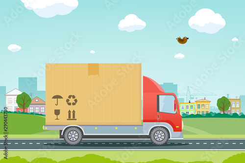 Moving houses. Truck carries a cardboard box with cargo.