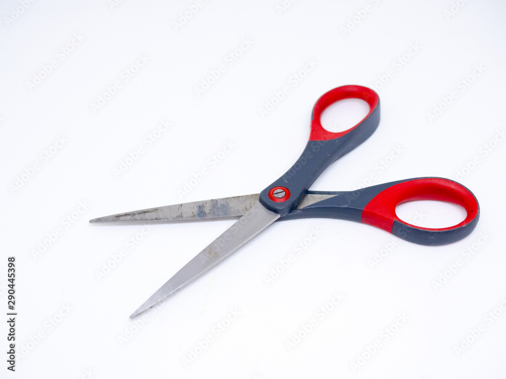 Old gray and red scissors on the White Blackground Old gray and red scissors on the White Blackground