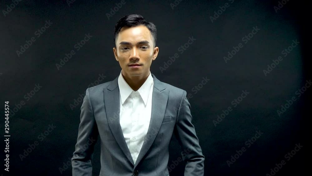 Handsome young man modeling a fashionable business suit Handsome young man modeling a fashionable business suit