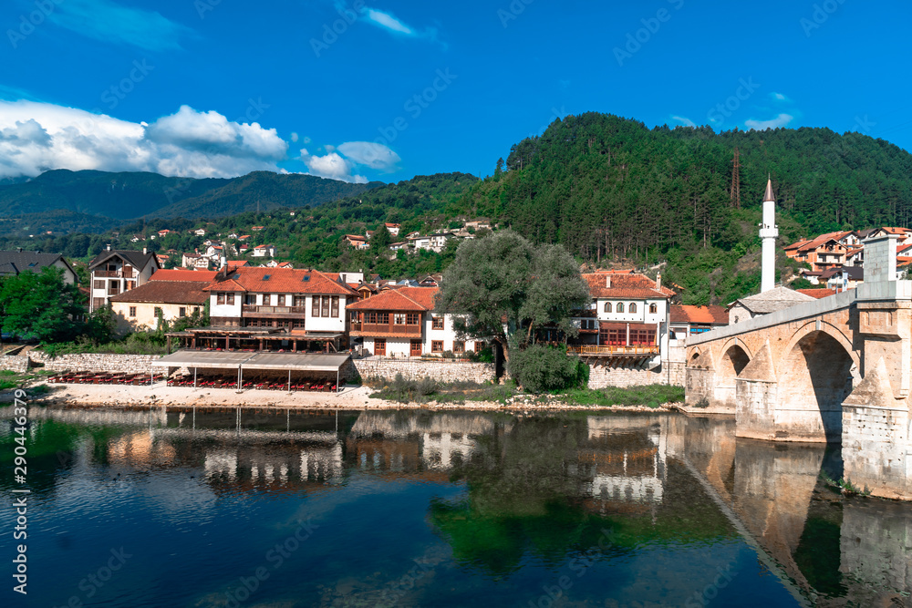 Neretva River and Houses with Old Bridge