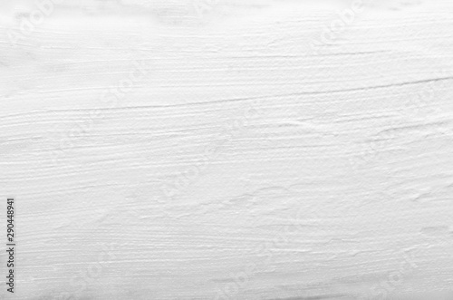White cosmetic cream smear and smudge texture background. Snow-white creamy substance, foundation, facial mask close-up. Paint abstract backdrop. Acrylic, oil surface macro wallpaper