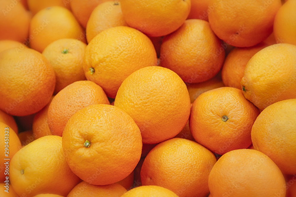 Fresh mandarin oranges texture. Fresh oranges lying on the counter - orange and tangerine texture with round oranges and tangerines Fresh mandarin oranges texture. Fresh oranges lying on the counter - orange and tangerine texture with round oranges and tangerines