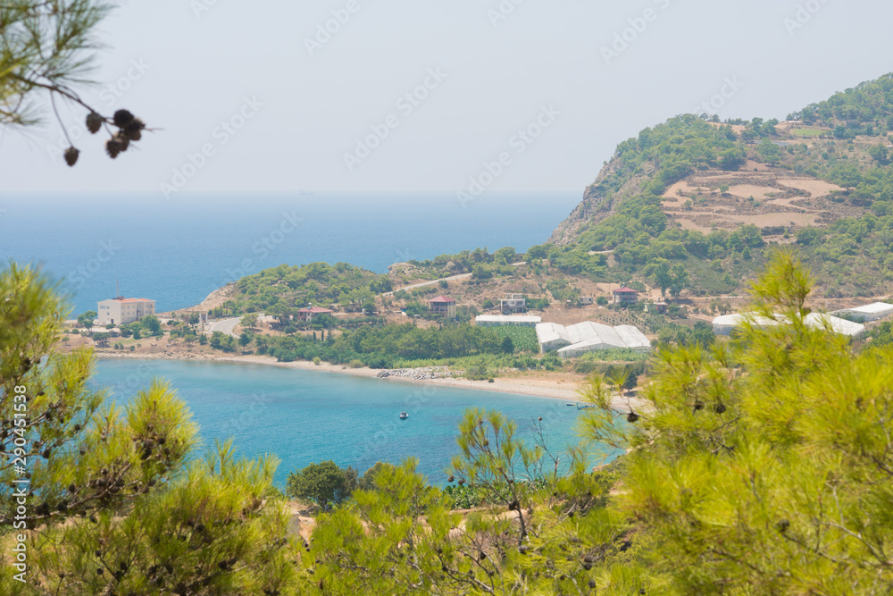 Beautiful scene of Mediterranean sea from a hill with pine trees forest. Turkey landscape.