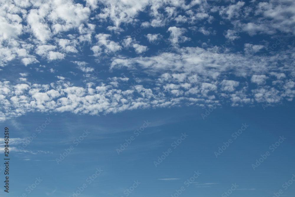 Small white fluffy cloud in the blue sky Small white fluffy cloud in the blue sky