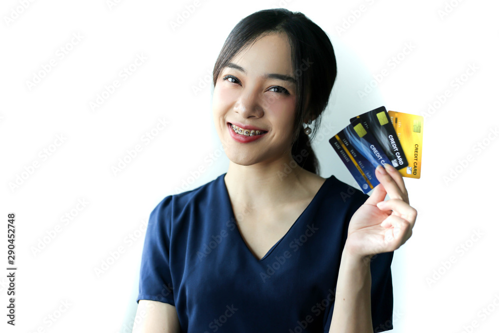 Portrait Asia smiling woman with credit card in hand,happy to have money concept. Portrait Asia smiling woman with credit card in hand,happy to have money concept.