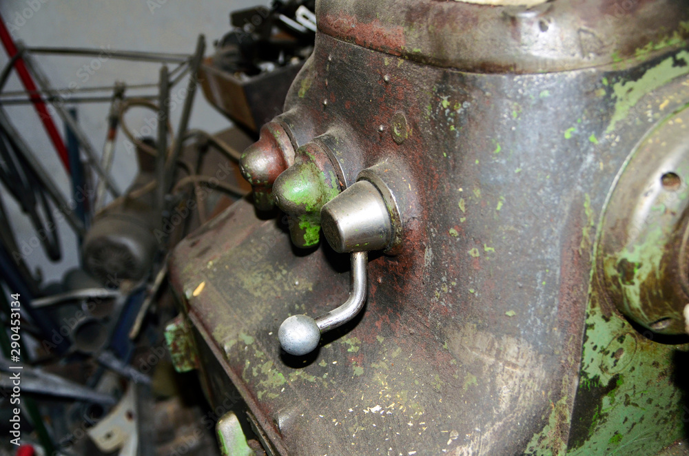 Detail of The Old lathe in the manufacture solution, the joystick . Selective focus Detail of The Old lathe in the manufacture solution, the joystick . Selective focus