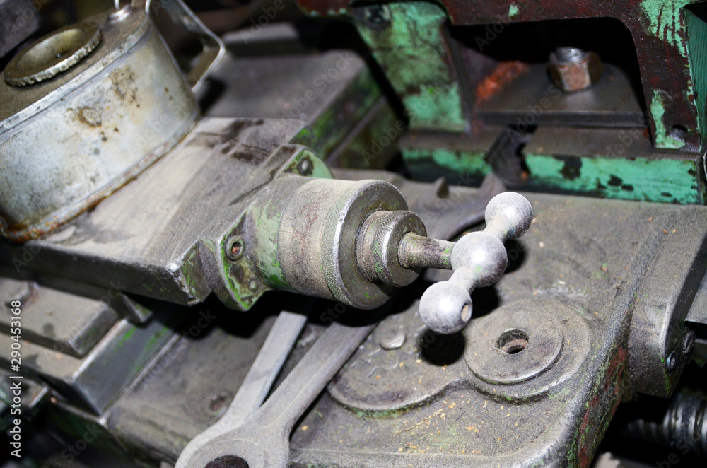 Detail of The Old lathe in the manufacture solution, the joystick . Selective focus Detail of The Old lathe in the manufacture solution, the joystick . Selective focus