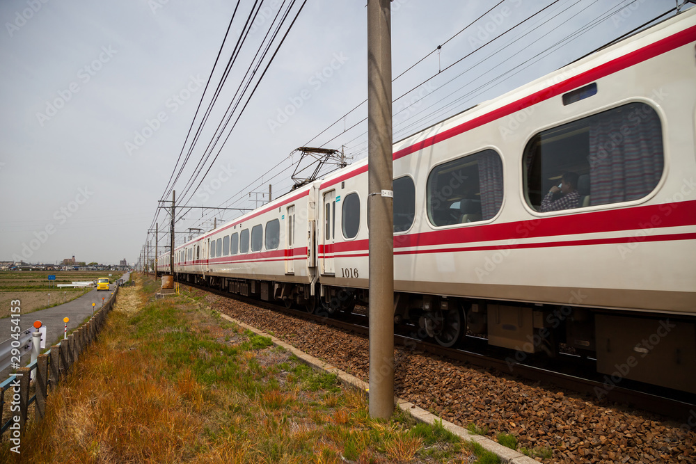Fototapeta premium NAGOYA, JAPAN - April 16, 2016: Meitetsu Limited Express travels on Toyohashi Line in Japan. Meitetsu Panorama Express train from Nagoya Meitetsu Station, (via Jingu Mae Station), Inuyama and Gifu.