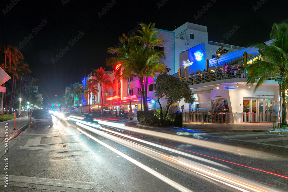 Night street at Ocean Drive in Miami Beach, Florida - hotels and restaurants at sunset on Ocean Drive, Miami Beach.