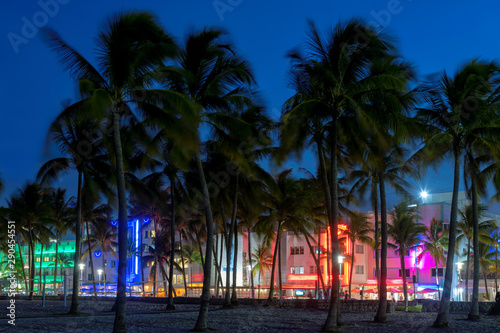 Hotels and restaurants at night on Ocean Drive, world famous destination. Nightlife in Miami Beach, Florida.