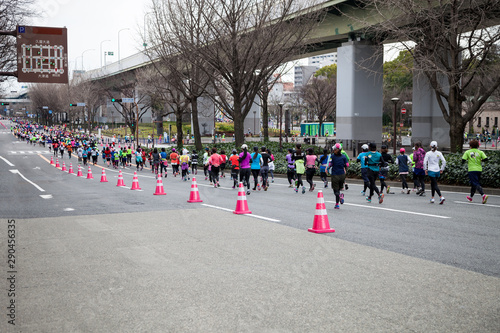NAGOYA, JAPAN - MARCH 13, 2016: Nagoya Women's Marathon 2016. .Women's running in the downtown. .Course Start and finish at Nagoya Dome Distance 42.195km. Nagoya city Japan.
