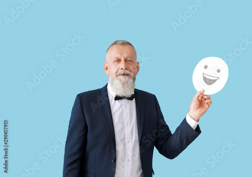 Mature man with emoticon on...