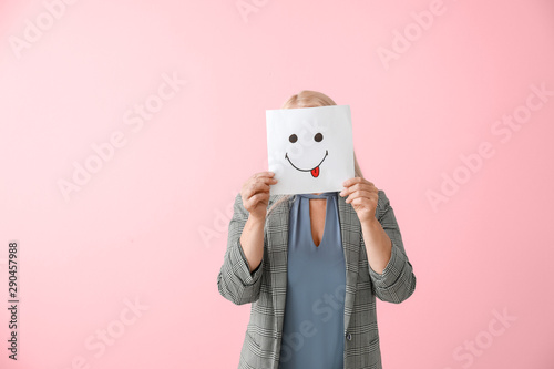 Mature woman hiding face be...