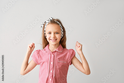 Portrait of happy little gi...