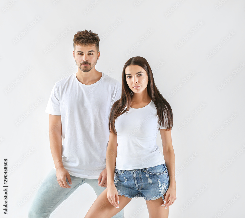 Fashionable young couple on white background Fashionable young couple on white background