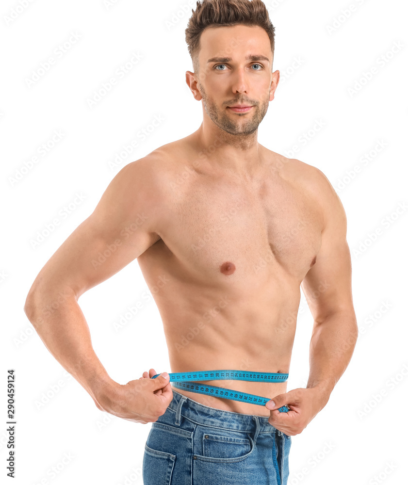 Handsome muscular man with measuring tape on white background. Weight loss concept Handsome muscular man with measuring tape on white background. Weight loss concept