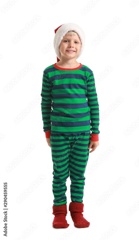 Cute little boy in pajamas and Santa Claus hat on white background Cute little boy in pajamas and Santa Claus hat on white background