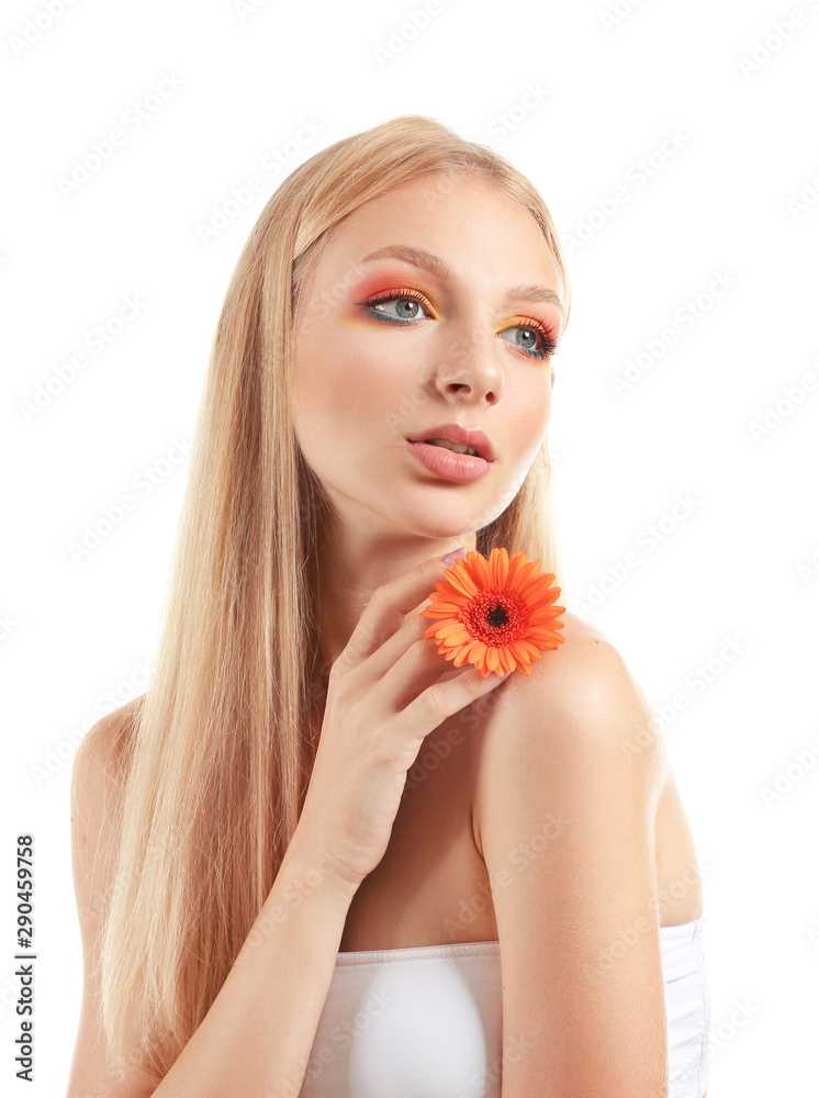 Beautiful young woman with gerbera flower on white background Beautiful young woman with gerbera flower on white background