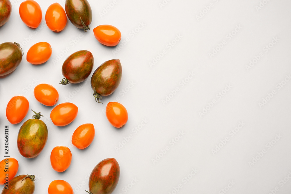 Different fresh tomatoes on light background Different fresh tomatoes on light background