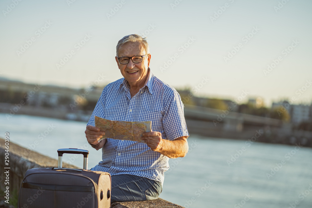 Outdoor portrait of senior man who is on vacation.