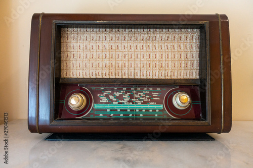 An old radio on an orange table