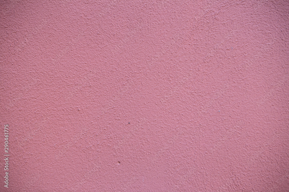 Fototapeta premium Old red brick wall. Old concrete wall. The facade of the house built of solid stone cement