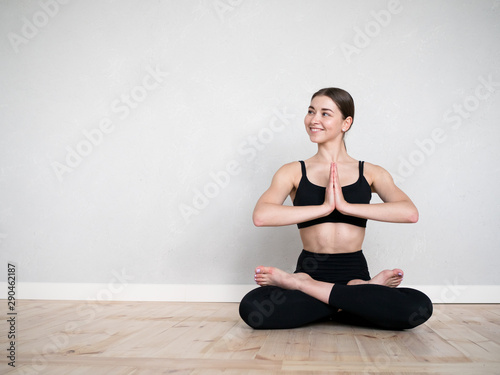 Attractive european girl doing yoga exercise