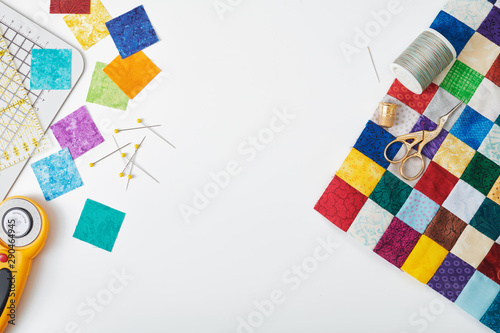 Fotografering Part of quilt sewn from colorful square pieces, bright square pieces of fabric,