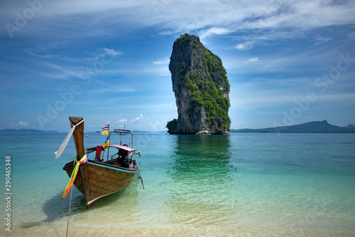 Traditional longtail boat and Poda island, Thailand.