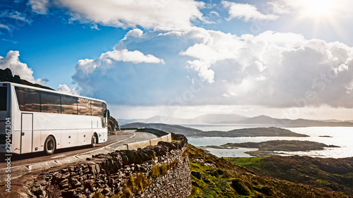 White tourist bus traveling photo