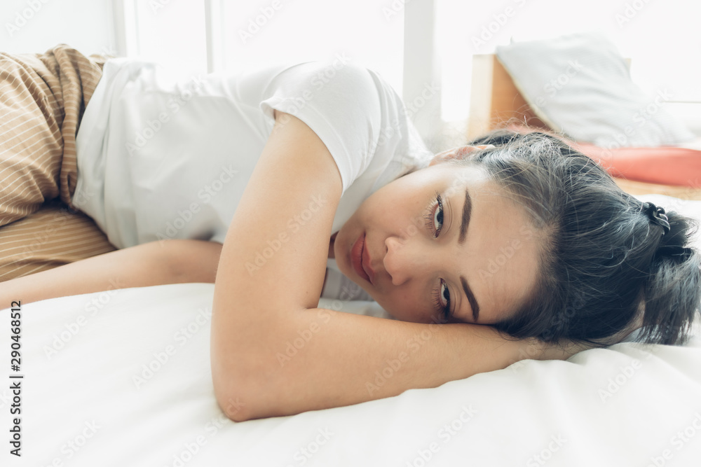 Funny face of Asian woman is sleeping on her white cozy bed. Stock Photo |  Adobe Stock