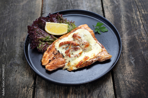 Fish fillet baked with sun-dried tomatoes and mozzarella cheese.