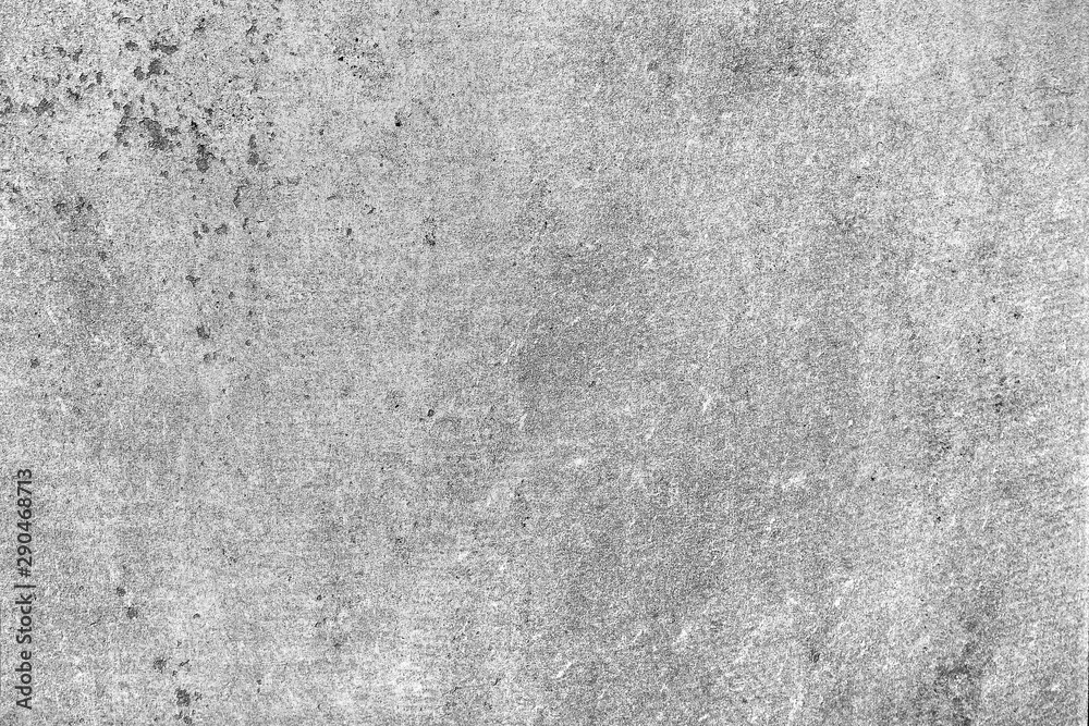 Gray concrete wall. Small cracks on the surface Gray concrete wall. Small cracks on the surface