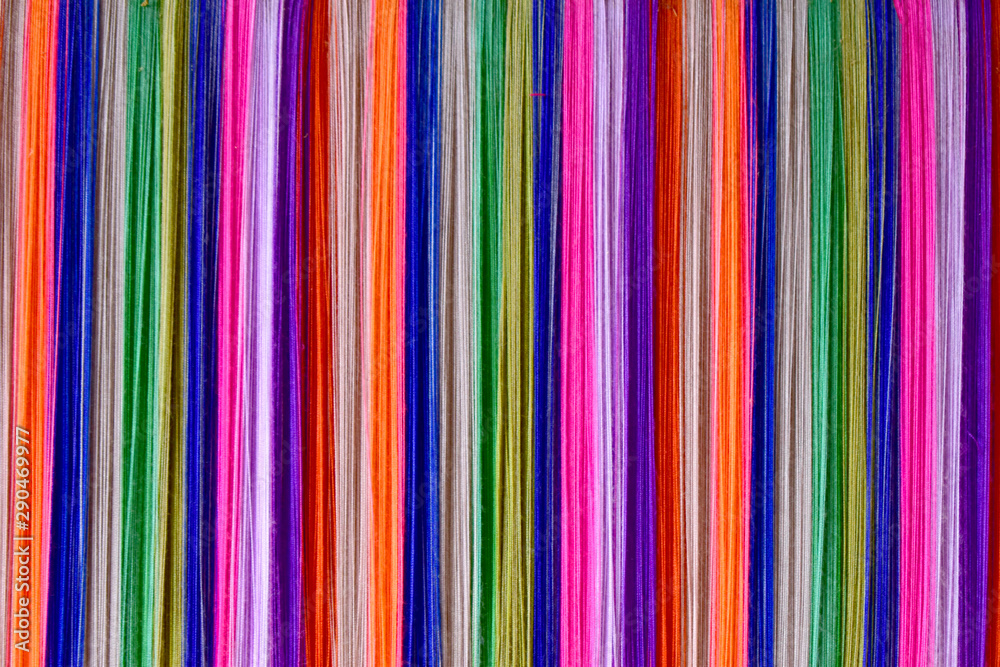 Colorful Silk threads on the loom Colorful Silk threads on the loom