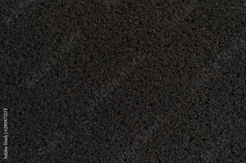 abstract dark black foam rubber texture, macro view, protection textured surface photo