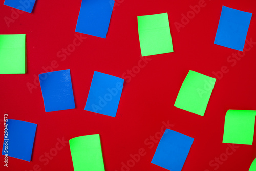 top view of some color paper stickers on the wall background, abstract idea