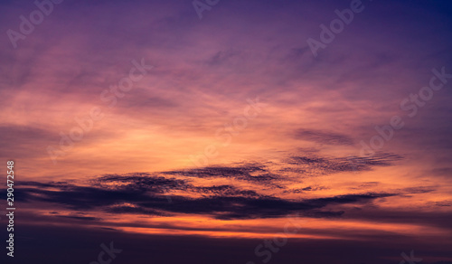 Beautiful sunset sky. Purple sky at sunset. Art picture of sky and dark clouds at dusk. Peaceful and tranquil concept. Twilight sky in evening. Background for life quote. Purple, red, and dark clouds.