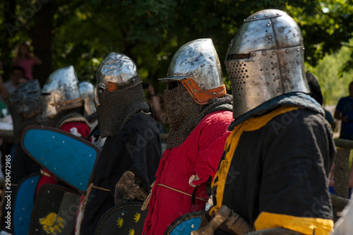 Knights in full armor are fighting in the arena. Medieval knight in the arena. Medieval knight in the Knight battles at the festival of medieval culture.