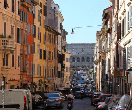 Fototapeta Naklejka Na Ścianę i Meble -  Rome, looking down the Via dei Serpenti towards the Colosseum on a summer's day.