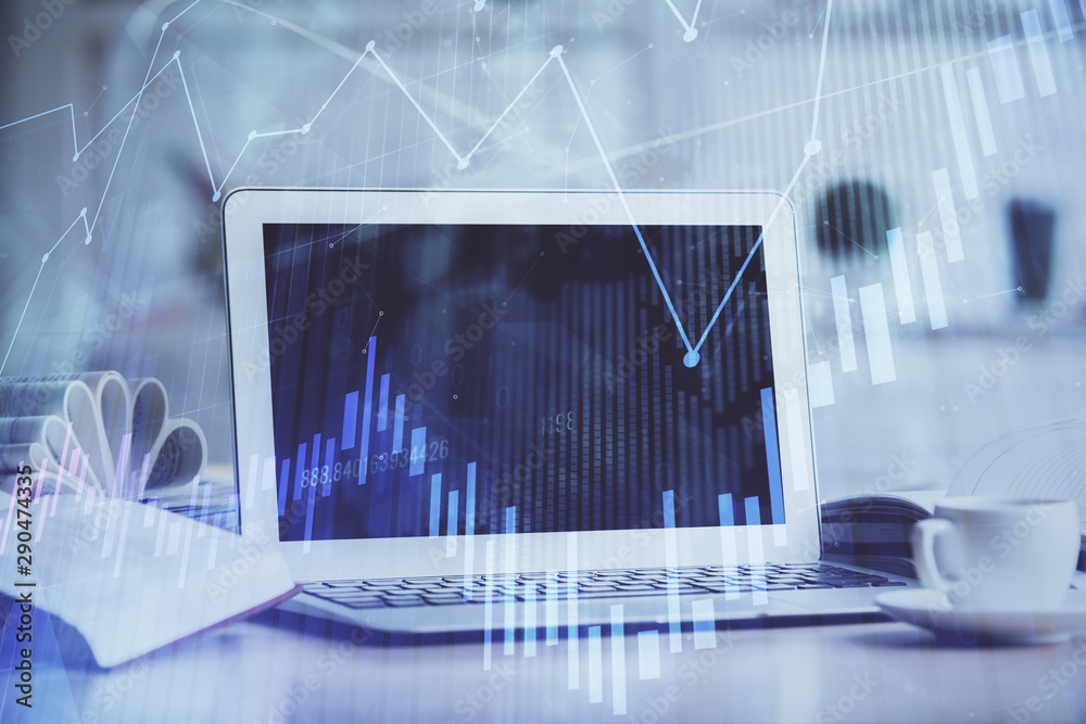 Forex Chart hologram on table with computer background. Multi exposure. Concept of financial markets. Forex Chart hologram on table with computer background. Multi exposure. Concept of financial markets.