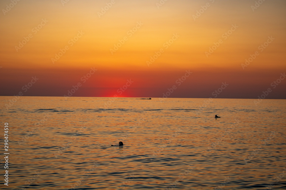 Sunny sunset on a warm and clear sea