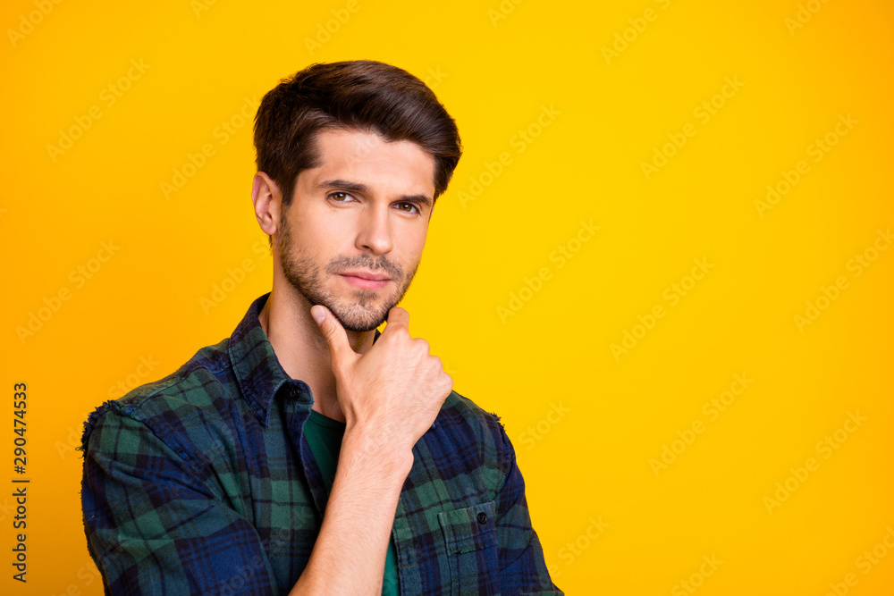 Closeup photo of amazing macho guy thinking about important business decision wear casual plaid shirt isolated yellow color background Closeup photo of amazing macho guy thinking about important business decision wear casual plaid shirt isolated yellow color background
