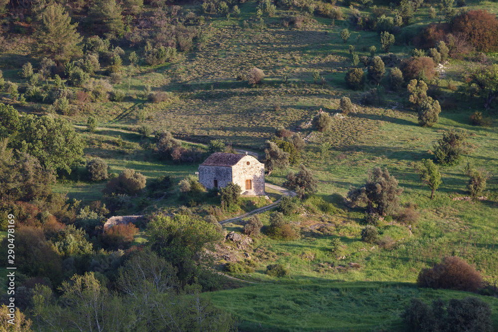 Fototapeta premium Cyprus rocky hills with agriculture, houses and small churches