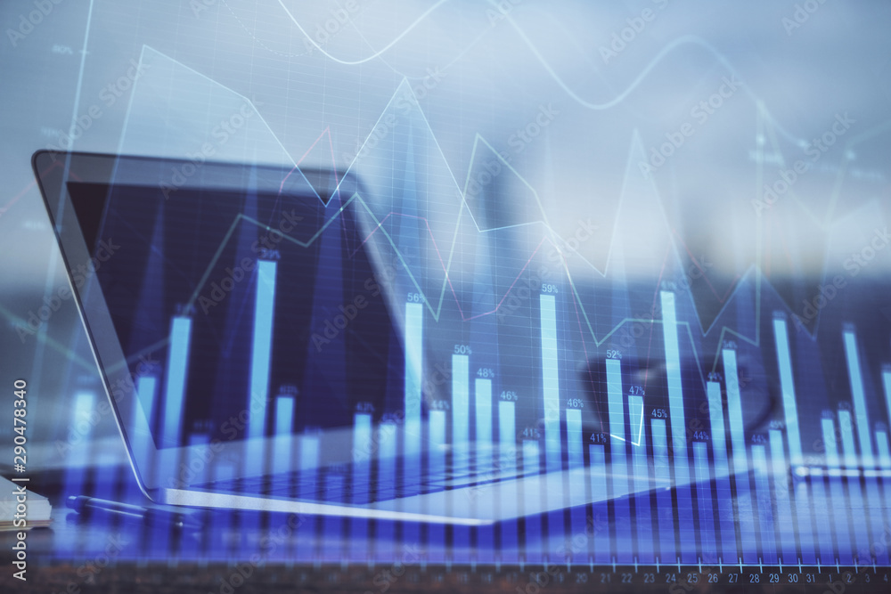 Stock market graph and table with computer background. Double exposure. Concept of financial analysis. Stock market graph and table with computer background. Double exposure. Concept of financial analysis.
