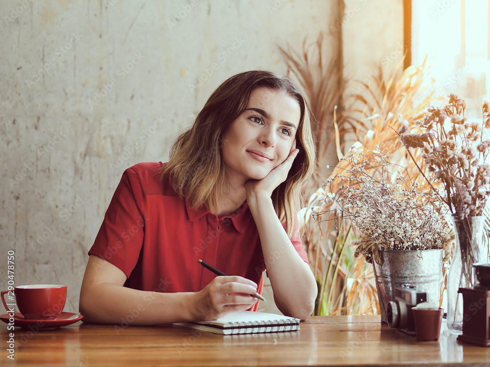 Beautiful woman thinking for idea with her work in coffee shop, lifestyle Beautiful woman thinking for idea with her work in coffee shop, lifestyle
