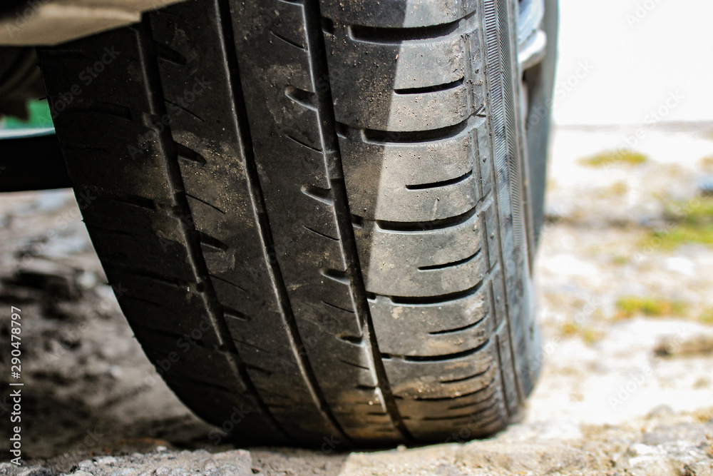 summer car tires in the dust on the ground summer car tires in the dust on the ground