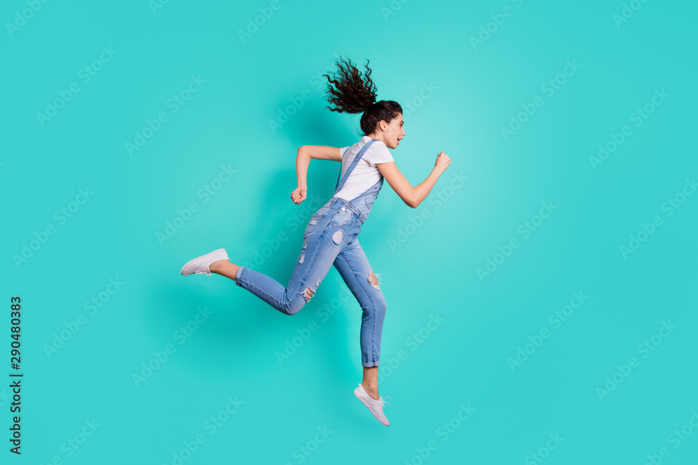 Full length body size view of her she nice attractive sportive purposeful wavy-haired girl jumping running fast marathon achievement isolated on bright vivid shine vibrant green turquoise background