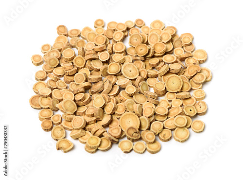Chinese Herbal medicine - Astragalus slices  Huang Qi  Astragalus propinquus  on white background 